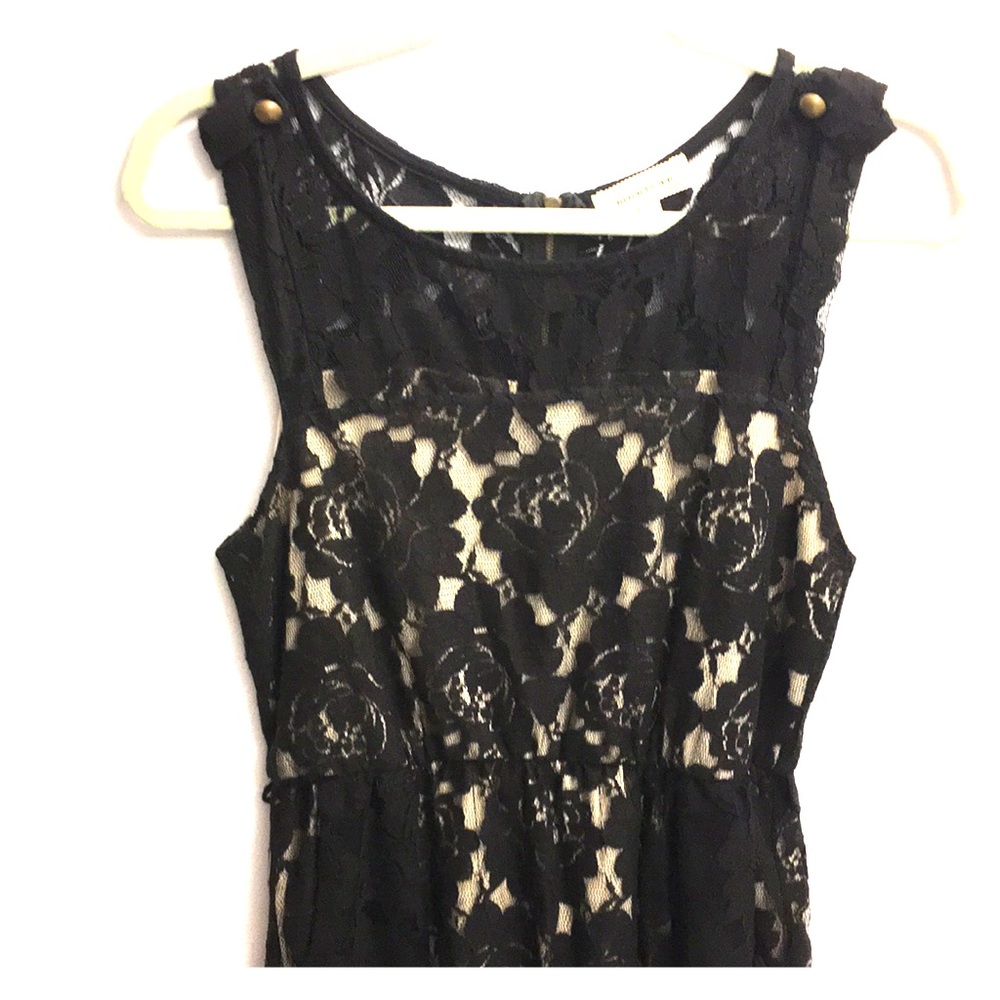 Lacy dress with gold buttons to each sleeve